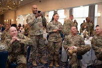 Airmen with the 11th Wing show support for the award winners at the Air Force District of Washington annual awards ceremony at Joint Base Anacostia-Bolling, Washington, D.C., April 9, 2026. The ceremony highlighted members across AFDW for their mission accomplishments throughout the year. (U.S. Air Force photo by Airman 1st Class Arlene Carrara)