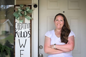 A woman poses for a portrait.