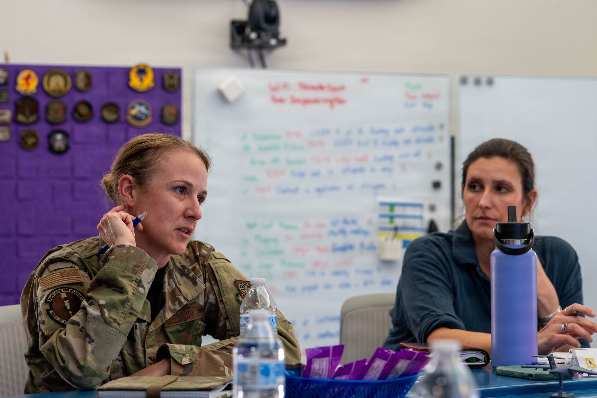 A photo of base leadership discussing innovation ideas.