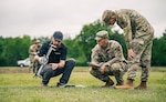 Two Oklahoma National Guardsmen along with a Skydio National Security Field Representative, one of many partners in drone innovation, prepare a drone for takeoff during Exercise Lightning Strike at Camp Gruber Training Center, Oklahoma, April 15, 2026. The Oklahoma National Guard, in partnership with Oklahoma Office of Emergency Management, hosted the domestic exercise based on a notional EF5 tornado. At the center of the exercise is the integration of uncrewed aircraft systems (UAS) across various scenarios, enabling real-time data sharing, improved situational awareness and more effective coordination among participating agencies. Exercise Lightning Strike brings together a wide range of agencies to operate within a shared framework, reinforcing the Guard’s role in supporting civil authorities during domestic incidents and natural disasters.(Oklahoma National Guard photo by Sgt. Anthony Ackah-Mensah)