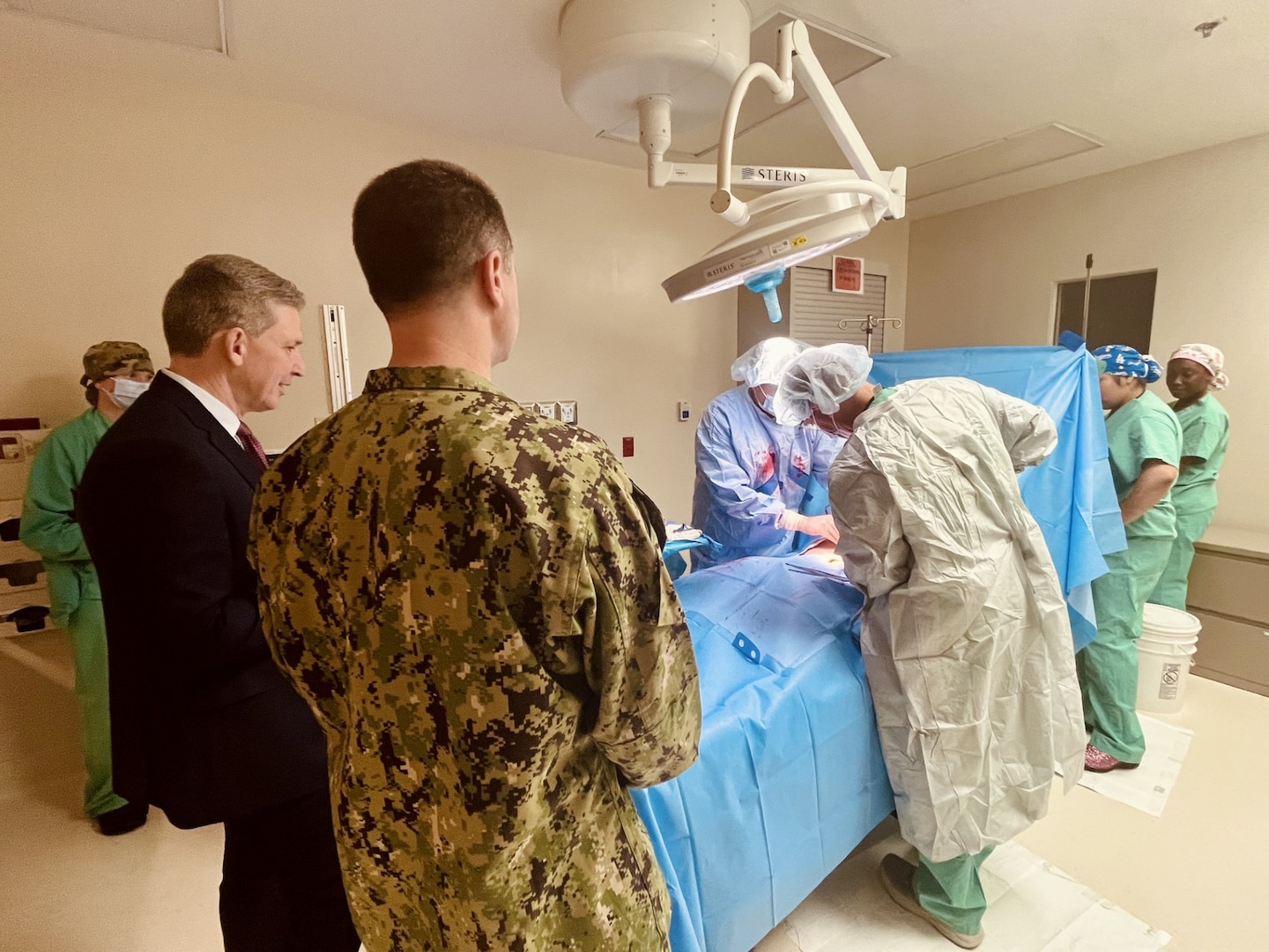 Assistant Secretary of War for Health Affairs, Honorable Keith Bass observes a surgical training procedure at Weed Army Community Hospital.