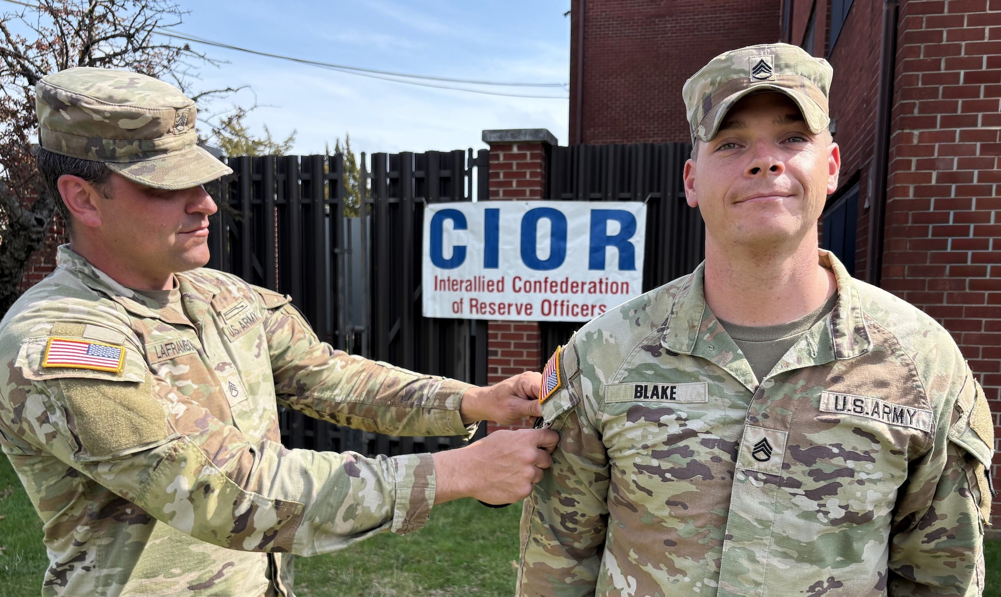 U.S. Army Reserve Staff Sgt. Austin Blake, right, combat engineer and Basic Leadership Course instructor, U.S. Army Noncommissioned Officer Academy Fort Dix, receives an Interallied Confederation of Reserve Officers (CIOR) patch from U.S. Army Reserve Staff Sgt. Corey Laframboise, training noncommissioned officer, U.S. Army Reserve Command G 3/5/7 Competitive Programs and planner for USARC’s CIOR selection competition, during the finale of the competition at Joint Base McGuire-Dix-Lakehurst, N.J., April 3, 2026. Blake was among five NCOs and seven officers selected from the competition, held March 30 - April 3, to represent the United States this summer in Europe at the 2026 CIOR Military Competition, where reserve forces from NATO nations will compete in challenges that test teamwork, endurance and combat skills. (U.S. Air Force photo by Kris Patterson)