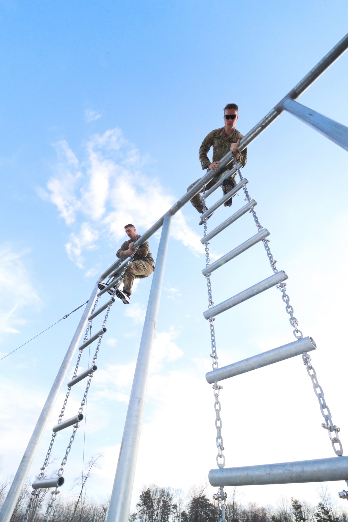 U.S. Army Reserve Staff Sgt. David Kratky, left, combat medical specialist and operations noncommissioned officer in charge, 452nd Field Hospital, and U.S. Army Reserve Capt. Mick McCarty, support division operations officer, U.S. Army Reserve Cyber Protection Brigade, climb the rope ladder on the NATO obstacle course during the U.S. Army Reserve Command’s Interallied Confederation of Reserve Officers (CIOR) selection competition at Joint Base McGuire-Dix-Lakehurst, N.J., April 1, 2026. Kratky and McCarty were among seven officers and five NCOs selected from the competition, held March 30 - April 3, to represent the United States this summer in Europe at the 2026 CIOR Military Competition, where reserve forces from NATO nations will compete in challenges that test teamwork, endurance and combat skills. (U.S. Army photo by Steven Roussel)