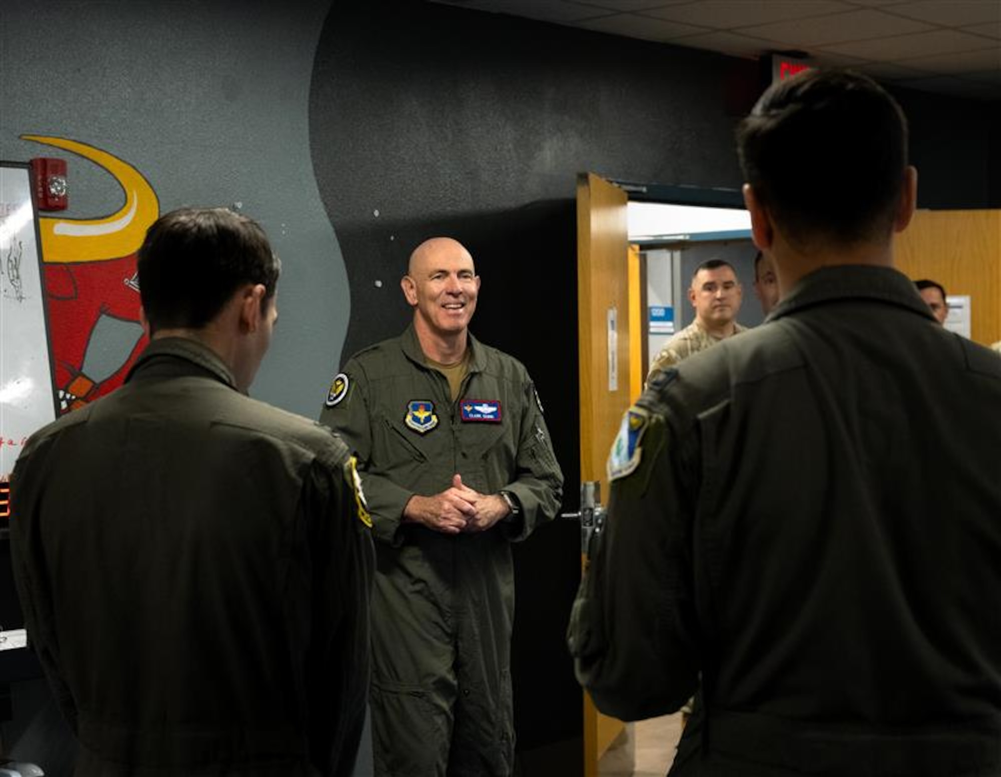 Lt. Gen. Clark Quinn, commander of Air Education and Training Command, speaks with Capt. Jacob Bautista, 85th Flying Training Squadron, instructor pilot and Capt. Andrew Bragado, 434th Fling Training Squadron, instructor pilot in the recently established Comprehensive Readiness For Aircrew Flying Training Tactical Athlete Center during a visit to Laughlin Air Force Base, Texas, April 14, 2026. Quinn had the opportunity to engage with Laughlin instructor pilots, opening up a two-way dialogue for discussion about the future of undergraduate pilot training. (U.S. Air Force photo by Airman 1st Class Harrison Sullivan