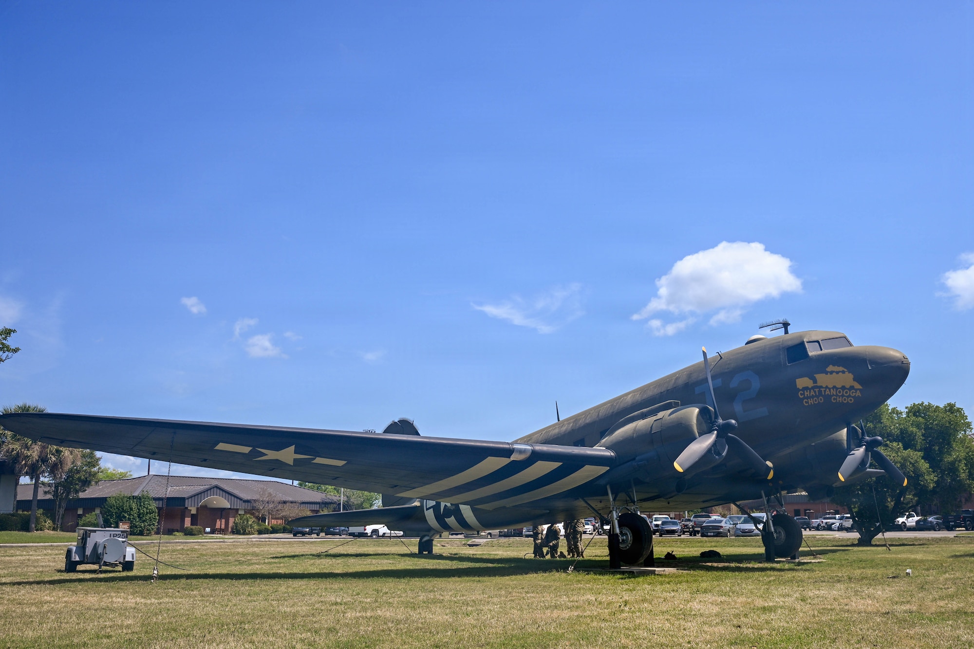 A photo of a static C-47 Skytrain sitting outside.