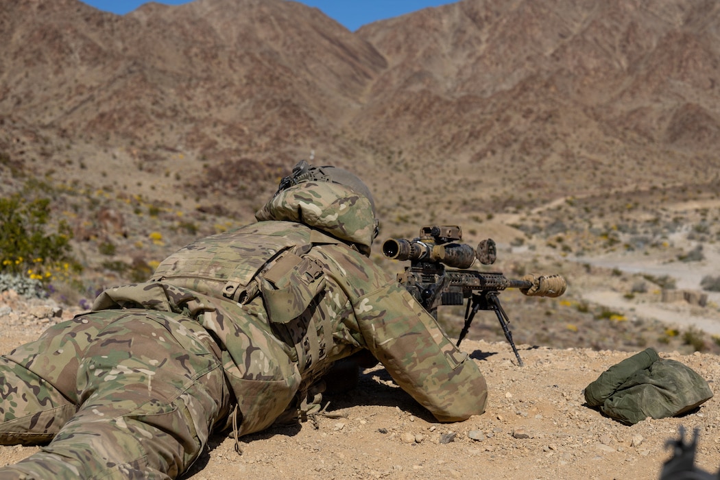 A Dutch Marine with Recce Sniper Troop, Netherlands Marine Corps, calculates distance and wind for a simulated threat during a live-fire exercise at Range 400, Marine Corps Air Ground Combat Center, Twentynine Palms, California, Feb. 13, 2026. The Netherlands Marine Corps visited MCAGCC to promote interoperability, strengthen partnerships and enhance strategic and tactical cooperation between U.S. and Dutch Marines. (U.S. Marine Corps photo by Lance Cpl. Jozef P. Majewski)