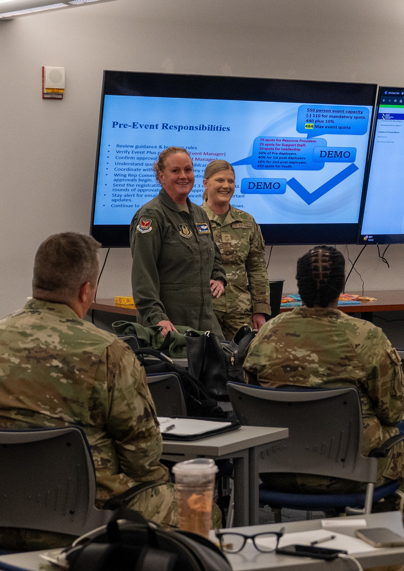Col. Elissa Granderson 302d AW commander and CMSgt Andrea Estes 302d WA command chief speak to wing representatives for the Yellow Ribbon Reintegration program at Peterson SFB.