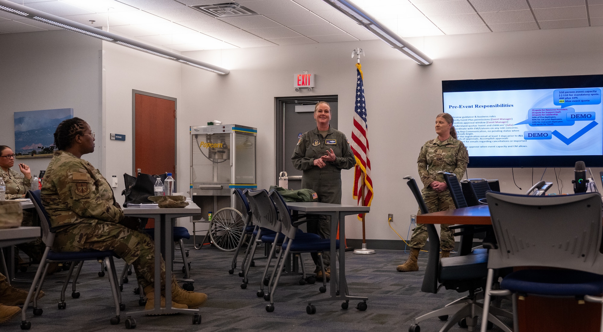 Col. Elissa Granderson 302d AW commander and CMSgt Andrea Estes 302d WA command chief speak to wing representatives for the Yellow Ribbon Reintegration program at Peterson SFB.