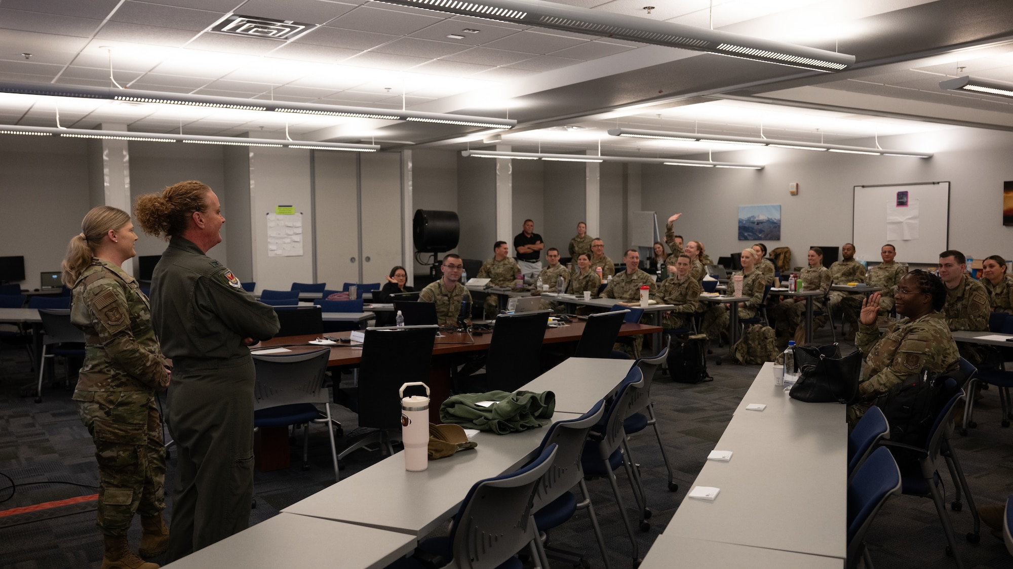 Col. Elissa Granderson 302d AW commander and CMSgt Andrea Estes 302d WA command chief speak to wing representatives for the Yellow Ribbon Reintegration program at Peterson SFB.