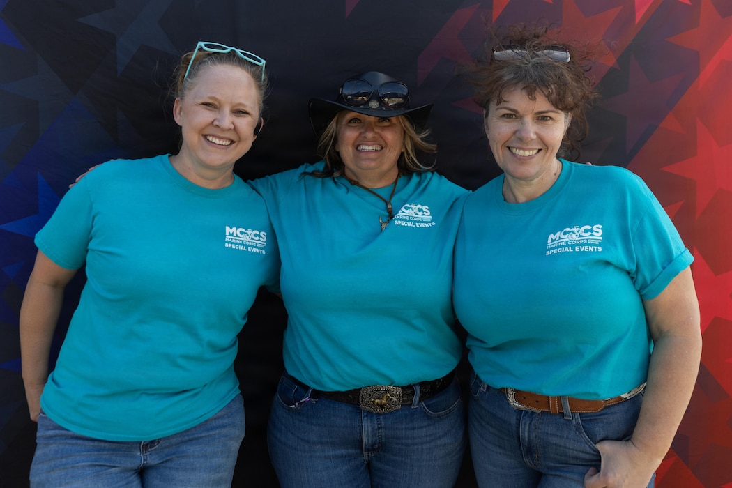 Kristina Viloria, left, Wanda Christians, middle, and Carrie Hendrickson, Marine Corps Community Services event staff, pose for a photo during Springfest at Desert Winds Golf Course, Marine Corps Air Ground Combat Center, Twentynine Palms, California, April 10, 2026. Springfest 2026 was hosted to create a fun and recreational spring themed event for service members and families aboard the Combat Center. (U.S. Marine Corps photo by Lance Cpl. Lainey Brummett)