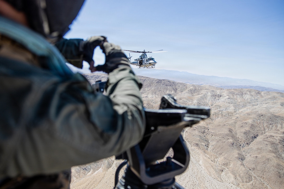 U.S. Marine Corps UH-1Y Venom utility helicopter assigned to Marine Light Attack Helicopter Squadron 169, Marine Aircraft Group 39, 3rd Marine Aircraft Wing, conduct a drone aviation integration test near Quackenbush training area, Marine Corps Air Ground Combat Center, Twentynine Palms, California, April 7, 2026. This sUAS integration training teaches Marines to adapt to enemy unmanned aircraft by emphasizing battlefield awareness, disciplined maneuvers, and a shared understanding of how these systems will shape future ground operations. (U.S. Marine Corps photo by Lance Cpl. Lainey Brummett)