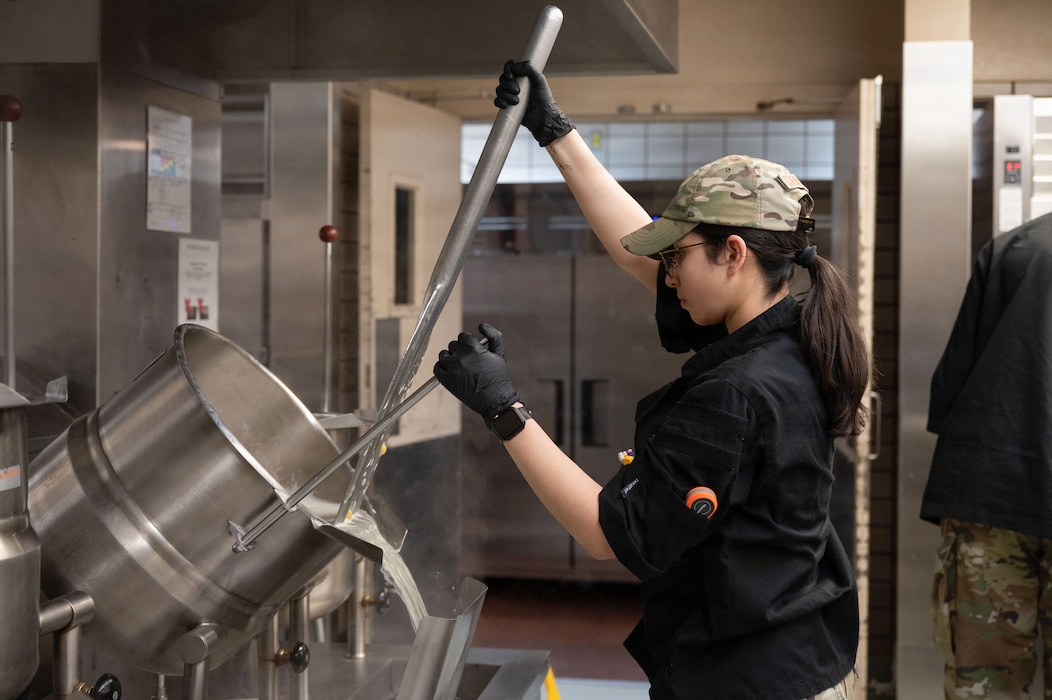U.S. Air Force Senior Airman Bailey Cuevas-Gluzman, 354th Force Support Squadron food service journeyman, empties water from a pot at Eielson Air Force Base, Alaska, March 31, 2026.