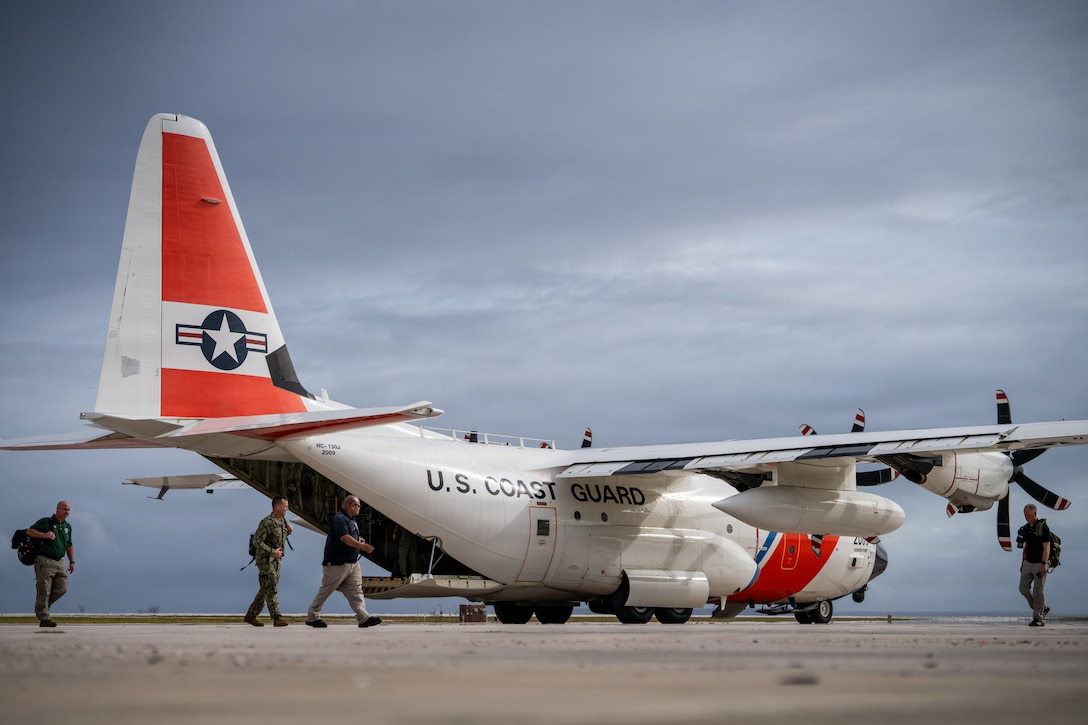 An HC-130 Hercules airplane crew assigned to U.S. Coast Guard Air Station Barbers Point in Kapolei, Hawaii, offloads personnel and supplies at the Francisco C. Ada/Saipan International Airport in I Fadang, Saipan, April 17, 2026. Coast Guard  aircrews transported personnel with FEMA, the U.S. Army Corps of Engineers, the Department of Public Health and Social Services, and the Department of War to Saipan in support of recovery efforts following Typhoon Sinlaku. (U.S. Coast Guard photo by Chief Petty Officer Corinne Zilnicki)