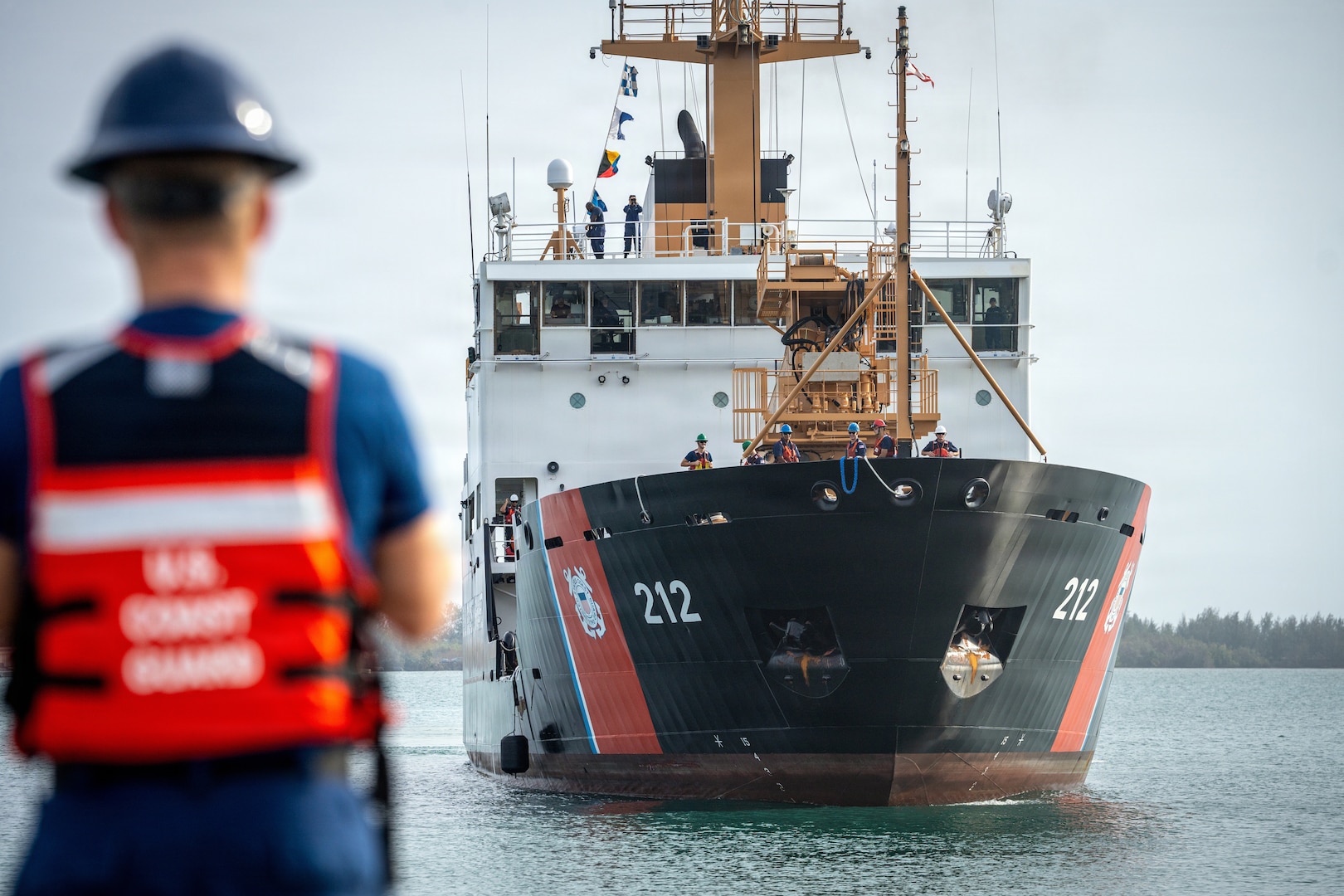 The crew of seagoing buoy tender USCGC Hickory (WLB-212) returns to homeport in Apra Harbor, Guam, April 18, 2026. The Hickory departed ahead of Typhoon Sinlaku’s impact and returned to assess ports, waterways, and aids to navigation in Guam and the Commonwealth of the Northern Mariana Islands, supporting port reconstitution and recovery efforts. (U.S. Coast Guard photo by Chief Petty Officer Corinne Zilnicki)