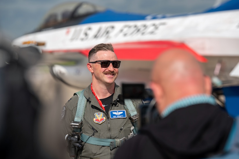 Capt. Chase Bennett, a pilot with the U.S. Air Force F-16 Viper Demonstration Team at Shaw Air Force Base, S.C., talks to local media at the Kentucky Air National Guard Base in Louisville, Ky., April 16, 2026 in advance of this weekend’s Thunder Over Louisville air show. The Kentucky Air Guard’s 123rd Airlift Wing is serving as the base of operations for military aircraft participating in the show. (U.S. Air National Guard photo by Phil Speck)
