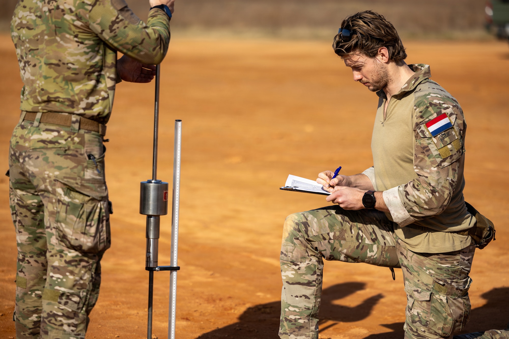 Dutch pathfinders assigned to the 11th Air Assault Brigade, Royal Netherlands Army, conducts dynamic cone penetrometer readings to determine the California Bearing Ratio, or soil strength, during a Landing Zone Safety Officer course at Holland Drop Zone, Fort Bragg, N.C., March 4, 2026.