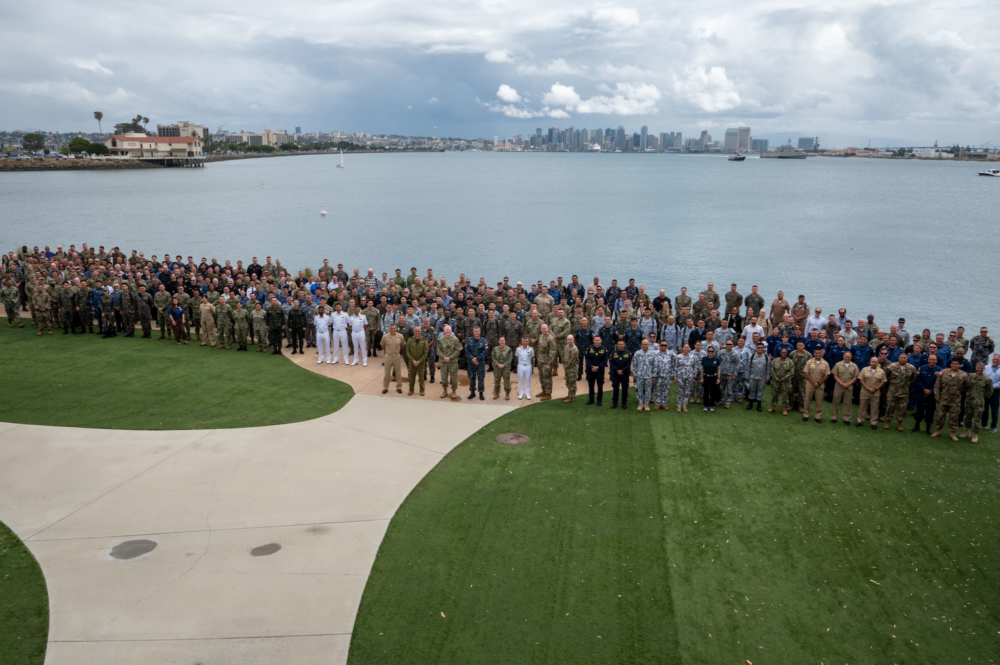 Members of partner and ally nations pose for a group photo during the Exercise Rim of the Pacific (RIMPAC) 2026 Final-Planning Conference at Naval Base Point Loma Annex in San Diego, April 14, 2026. RIMPAC is the world's largest international maritime exercise, providing a unique training opportunity that fosters and sustains cooperative relationships among participants. These relationships are critical to ensuring the safety of sea lanes and security on the world's oceans. RIMPAC 2026 marks the 30th iteration of the biennial exercise, which began in 1971. (U.S. Navy photo by Mass Communication Specialist 1st Class Brandon Roberson)