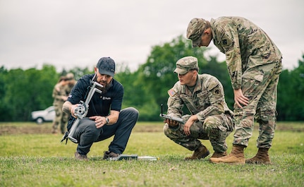 Two Oklahoma National Guardsmen along with a Skydio National Security Field Representative, one of many partners in drone innovation, prepare a drone for takeoff during Exercise Lightning Strike at Camp Gruber Training Center, Oklahoma, April 15, 2026. The Oklahoma National Guard, in partnership with Oklahoma Office of Emergency Management, hosted the domestic exercise based on a notional EF5 tornado. At the center of the exercise is the integration of uncrewed aircraft systems (UAS) across various scenarios, enabling real-time data sharing, improved situational awareness and more effective coordination among participating agencies. Exercise Lightning Strike brings together a wide range of agencies to operate within a shared framework, reinforcing the Guard’s role in supporting civil authorities during domestic incidents and natural disasters.(Oklahoma National Guard photo by Sgt. Anthony Ackah-Mensah)