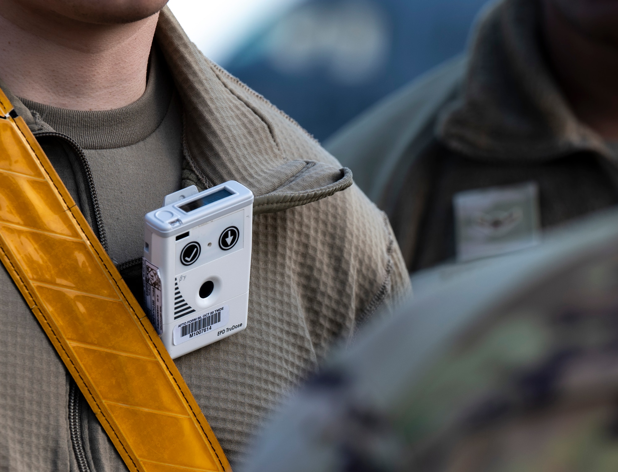 An electronic personal dosimeter clings to a U.S. Air Force Airman’s shirt during Radiant Falcon training at Joint Base McGuire-Dix-Lakehurst, N.J., March 26, 2026