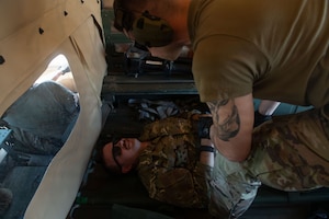 An Airman from the 137th Special Operations Wing, Oklahoma Air National Guard, cares for a simulated patient during exercise Sentry South 26-2 at Camp Shelby Joint Forces Training Center, Mississippi, March 2, 2026. Sentry South 26-2 is a large force employment exercise focused on major combat operations and joint maritime opportunities in a contested or degraded operational environment. Sentry South 26-2 applies joint and combined warfighting doctrine against realistic and robust enemy integrated threat systems, all while under safe and controlled conditions. (U.S. Air National Guard photo by Staff Sgt. Nicholas Swift)