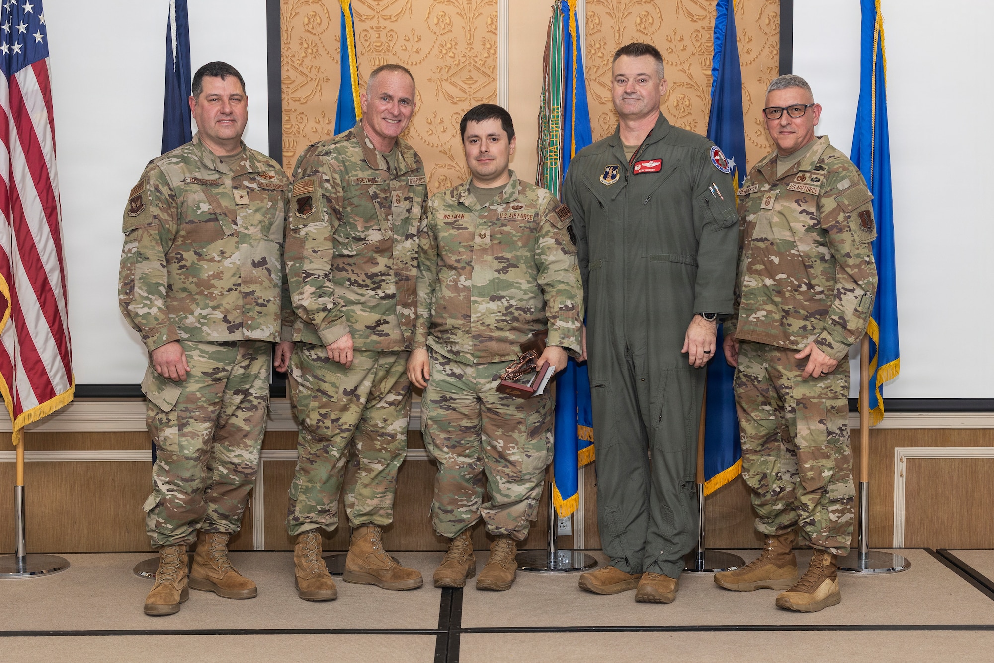 Tech. Sgt. John Willman, center, 192nd Mission Support Group, accepts the 2026 Virginia Air National Guard Overall Outstanding Non-Commissioned Officer of the Year Award