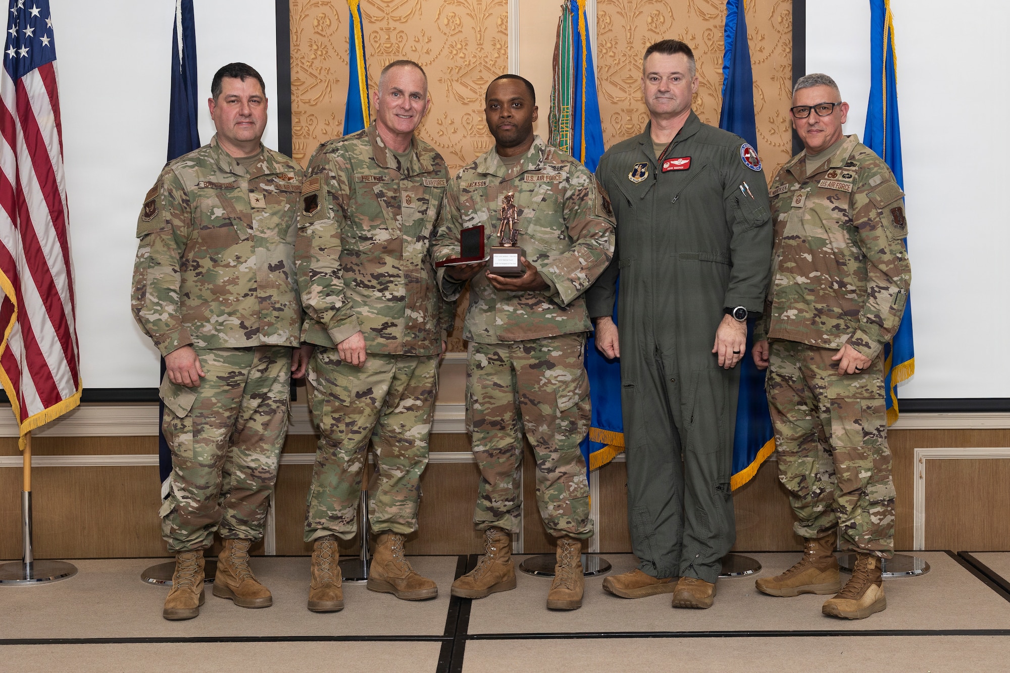 Master Sgt. Louis Jackson, center, 192nd Maintenance Group, accepts the 2026 Virginia Air National Guard First Sergeant of the Year Award