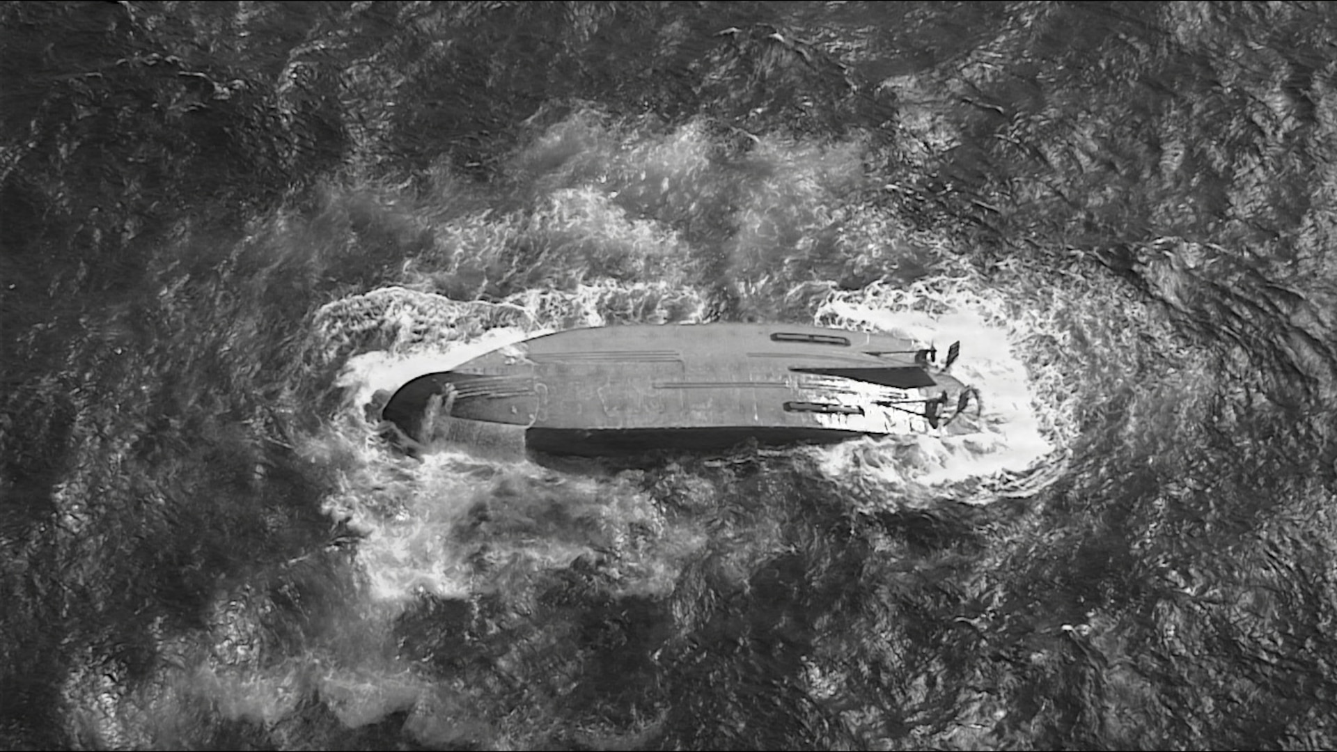A U.S. Coast Guard HC-130 Hercules airplane crew assigned to Coast Guard Air Station Barbers Point flies over an overturned vessel offshore Saipan, April 18, 2026. The Coast Guard and partners are searching for a 145-foot missing vessel, the Mariana, that experienced an engine failure April 15, 2026. (U.S. Coast Guard photo Courtesy Air Station Barbers Point)