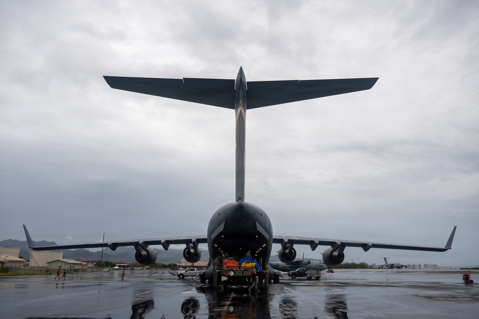 A U.S. Air Force C-17 Globemaster III is loaded with rafts and supplies.