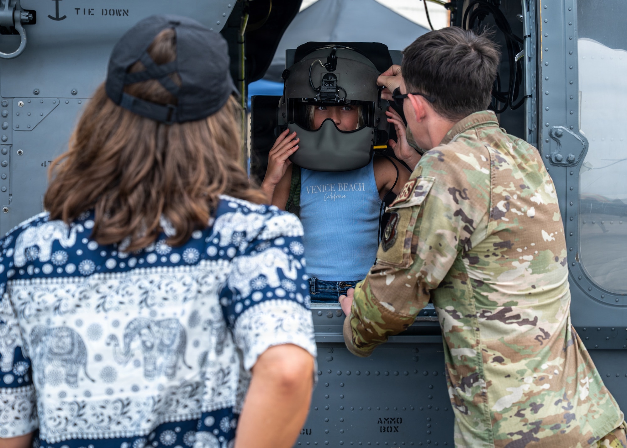 Festival attendees tour a HH-60W Jolly Green II display during America Fest 2026 at Kadena Air Base, Japan.