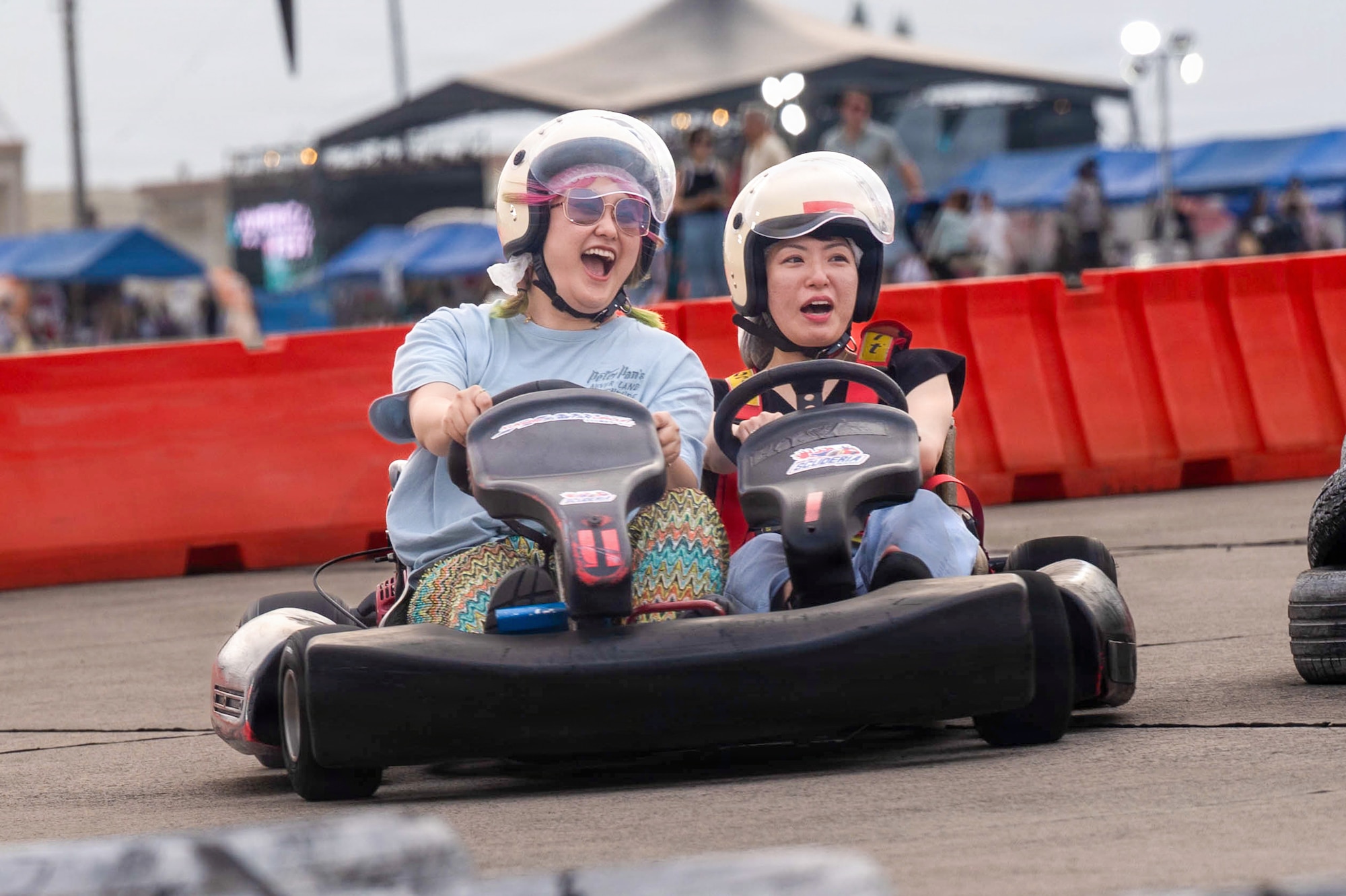 Festival attendees participate in activities with go-karts during America Fest 2026 at Kadena Air Base, Japan.