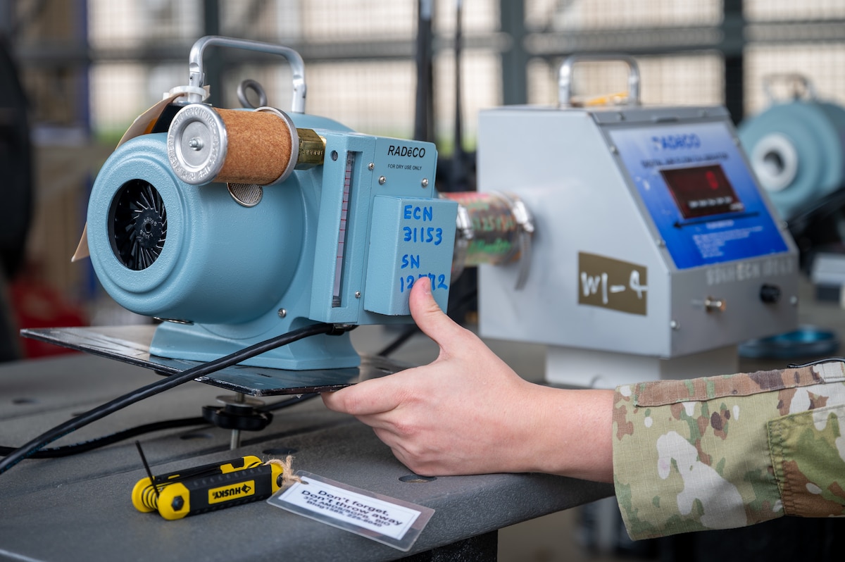 An Airman uses a radiological survey instrument.
