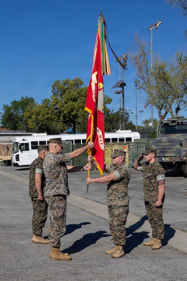 U.S. Marine Corps Lt. Col. Davis B. Gooding III, left, 2nd Battalion, 23rd Marine Regiment, 4th Marine Division, receives the guidon from Sgt. Maj. Rene Morelos, right, the senior enlisted advisor of 2nd Bn., 23rd Marine Regiment, 4th MARDIV, during a change of command ceremony in Pasadena, Calif., March 14, 2026. During the ceremony, Lt. Col. Davis B. Gooding III relinquished command of the battalion to Lt. Col. Michael P. Smith. The ceremony signified the transfer of accountability, responsibility and authority to new leadership and the continuity of command. (U.S. Marine Corps photo by Lance Cpl. Adrian Estrada)