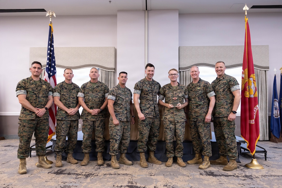 U.S. Marines with 2nd Marine Aircraft Wing pose for a photo during a Marine Corps Aviation Association nominee banquet at Marine Corps Air Station Cherry Point, North Carolina, April 15, 2026. The MCAA hosted a banquet to recognize the Marines and units nominated for the 2026 Marine Corps Aviation Association Awards. (U.S. Marine Corps photo by Cpl. Mya Seymour)