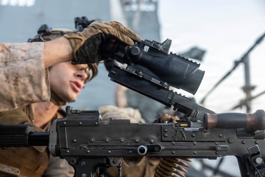 A U.S. Marine with Battalion Landing Team 3/6, 22nd Marine Expeditionary Unit (Special Operations Capable), loads an M240B machine gun during a deck shoot aboard San Antonio-class amphibious transport dock USS Fort Lauderdale (LPD 28), while underway in the Caribbean Sea, April 7, 2026. U.S. military forces are deployed to the Caribbean in support of the U.S. Southern Command mission, Department of War-directed operations, and the president’s priorities to disrupt illicit drug trafficking and protect the homeland. (U.S. Marine Corps photo)