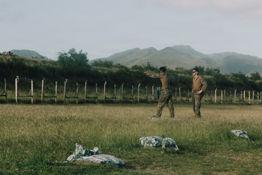 A U.S. Marine Corps rifleman with India Company, Battalion Landing Team 3/6, 22nd Marine Expeditionary Unit (Special Operations Capable), fires an M18 pistol during a competition-style live-fire range at Camp Santiago, Puerto Rico, April 10, 2026. U.S. military forces are deployed to the Caribbean in support of the U.S. Southern Command mission, Department of War-directed operations, and the president’s priorities to disrupt illicit drug trafficking and protect the homeland. (U.S. Marine Corps photo)