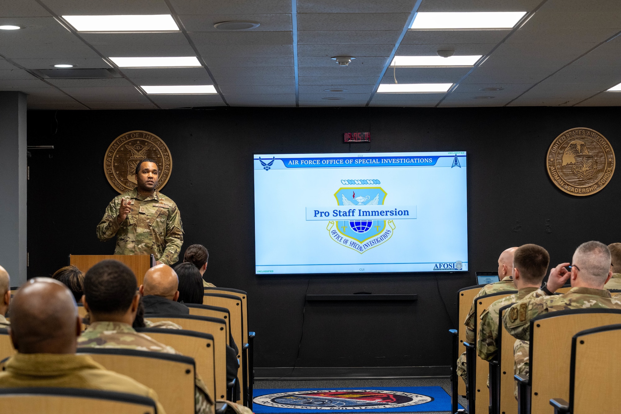 Special Agent Senior Master Sgt. Aaron Simmons, senior enlisted leader, AFOSI Washington Field Office, delivers remarks during an Air Force Office of Special Investigations immersion event March 30 in the Airman Leadership School building at Joint Base Andrews, Maryland.