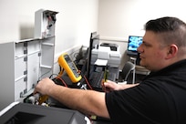 Mark Kisel, lead biomedical equipment technician at U.S. Army Medical Logistics Command’s Medical Maintenance Operations Division at Tobyhanna Army Depot, Pennsylvania, performs checks on a medical device. Kisel is one of several technicians from MMOD-PA who are part of the division’s “fly-away team,” a group of expert techs who can deploy into the field to provide maintenance support to operational units.