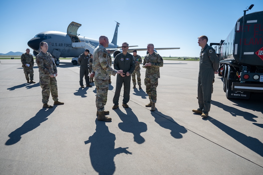 U.S. Air Force Chief of Staff Gen. Ken Wilsbach, center, and Chief Master Sgt. of the Air Force David Wolfe, center right, speak to Fuels Airmen during an immersion at Altus Air Force Base, Oklahoma, April 16, 2026. The might of the 97th Air Mobility Wing was on full display, highlighting how Altus directly supports the Chief of Staff’s priorities. Guided by the wing’s vision—“Victory Begins Here”—Altus Airmen deliver the training and readiness that underpin global mobility operations. (U.S. Air Force photo by Airman 1st Class Nathan Langston)