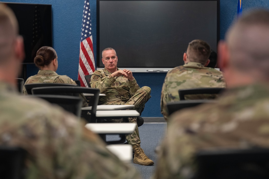Chief Master Sgt. of the Air Force David Wolfe, center, speaks with Foundations, Airman Leadership School and Airman Dorm Leader instructors during a visit to Altus Air Force Base, Oklahoma, April 16, 2026. The discussions emphasized the role Altus plays in developing the next generation of Airmen through high standards, accountability and technical excellence. (U.S. Air Force photo by Airman 1st Class Emma Wright)