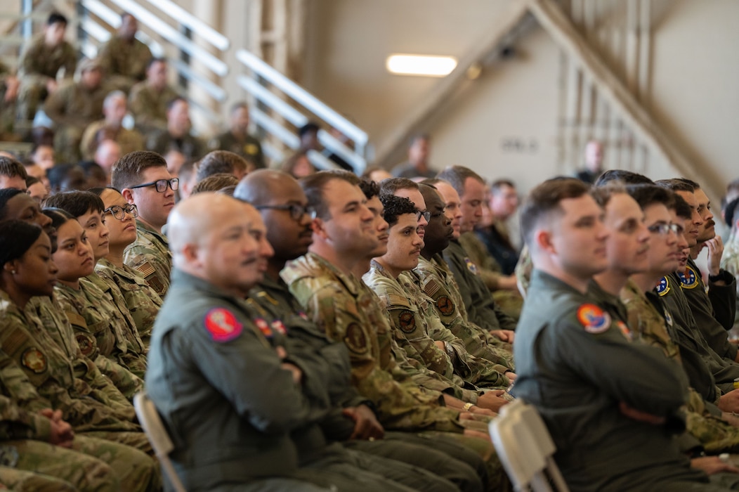 Airmen from across the 97th Air Mobility Wing attend an all call hosted by U.S. Air Force Chief of Staff Gen. Ken Wilsbach, and Chief Master Sgt. of the Air Force David Wolfe, speak during an immersion visit at Altus Air Force Base, Oklahoma, April 16, 2026. The all call provided an opportunity for senior leaders to connect with Airmen at every level, answer questions, and discuss the challenges and opportunities facing today’s Air Force. (U.S. Air Force photo by Tech. Sgt. Hailey Haux)