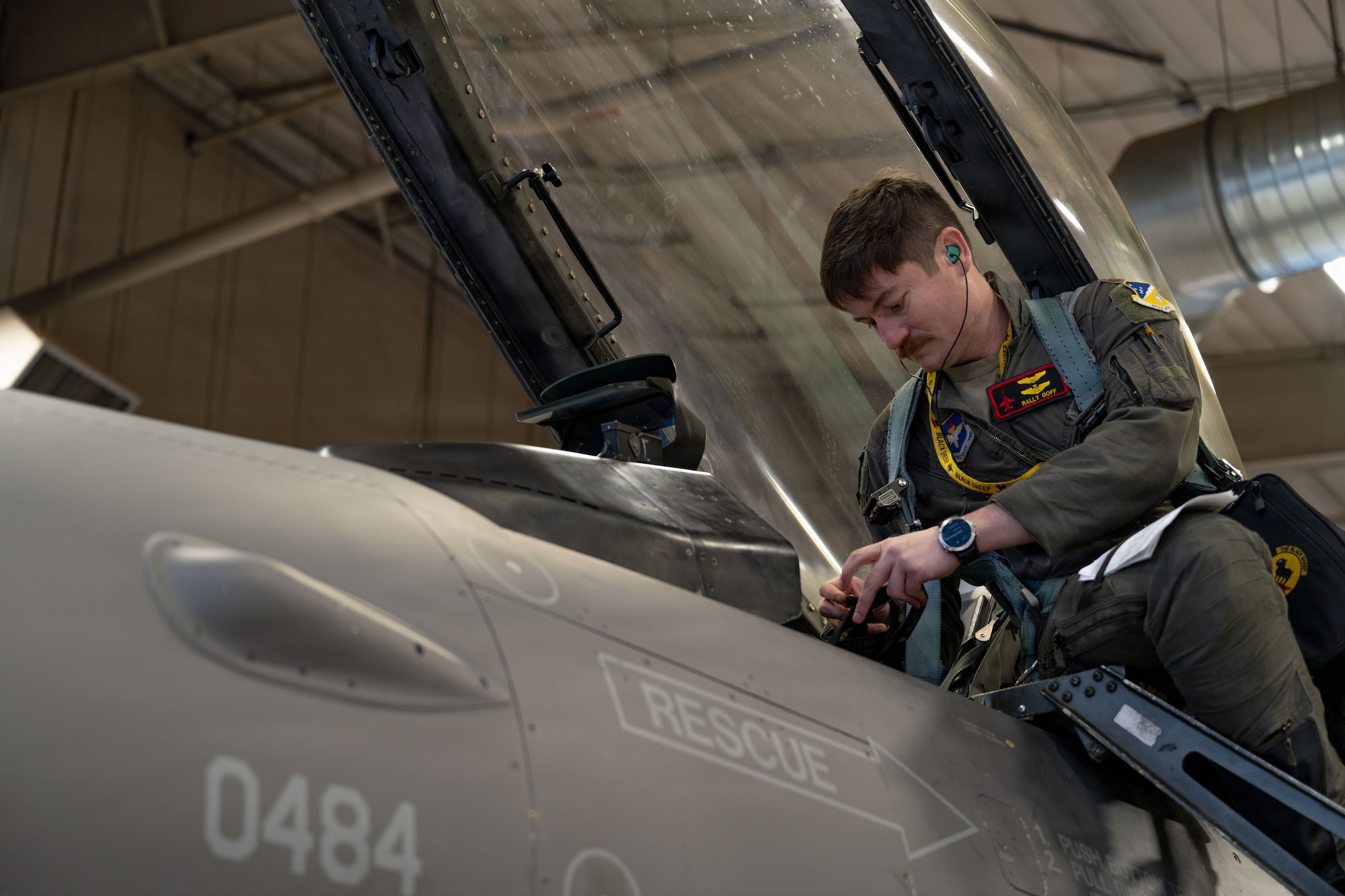 U.S. Air Force Maj. Timothy Goff, 8th Fighter Squadron pilot, enters the cockpit of an F-16 Fighting Falcon to perform a preflight check at Holloman Air Force Base
