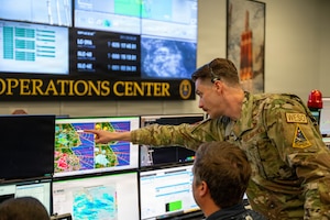 U.S. Space Force Air Force Maj. Kyle Vanyo, 45th Weather Squadron assistant director of operations points at weather diagnostics during pre launch operations at Cape Canaveral Space Force Station, Florida, April 1, 2026.