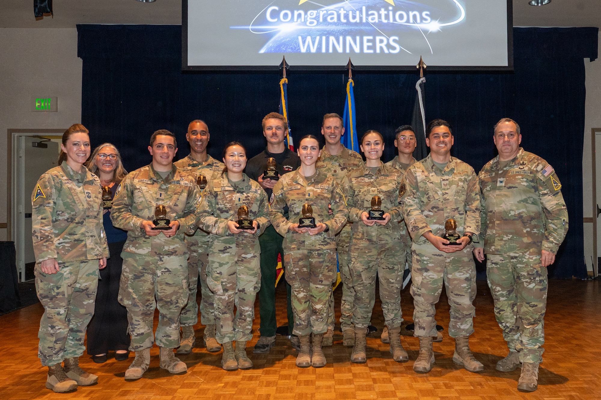 Space Launch Delta 30 members stand and pose for a group photo