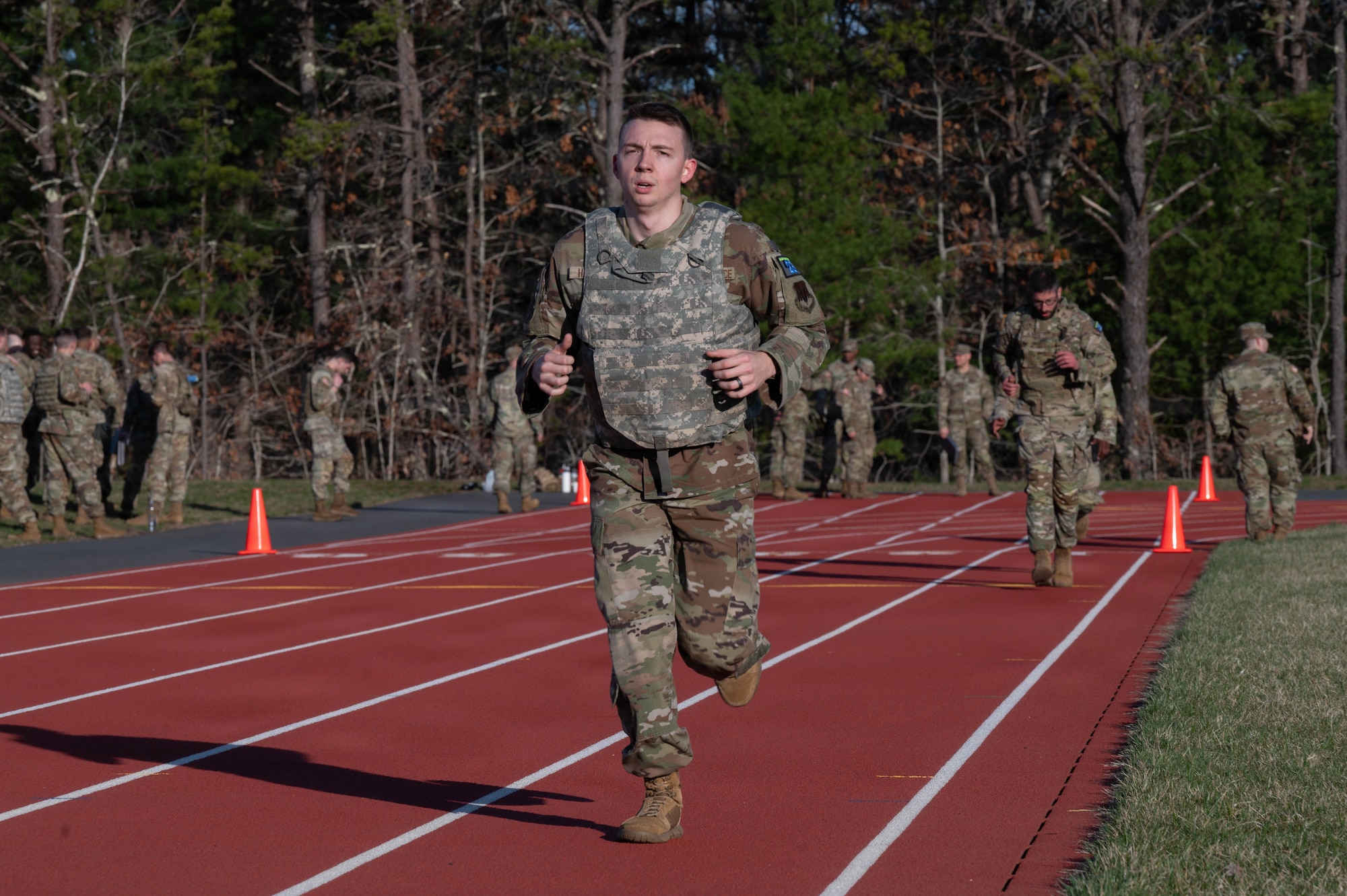 Airman runs on a track.