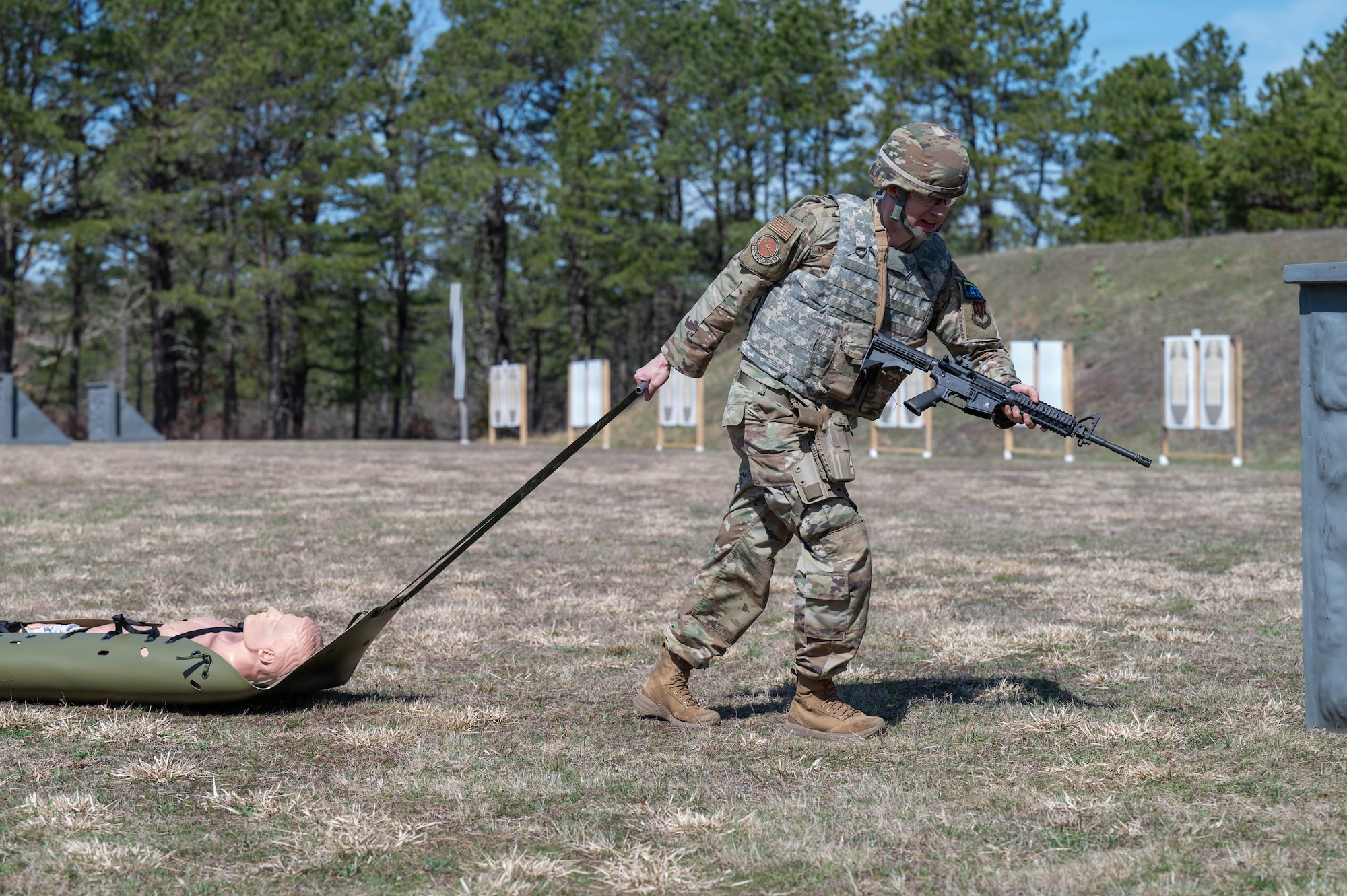 Airman drags a skid with a dummy.