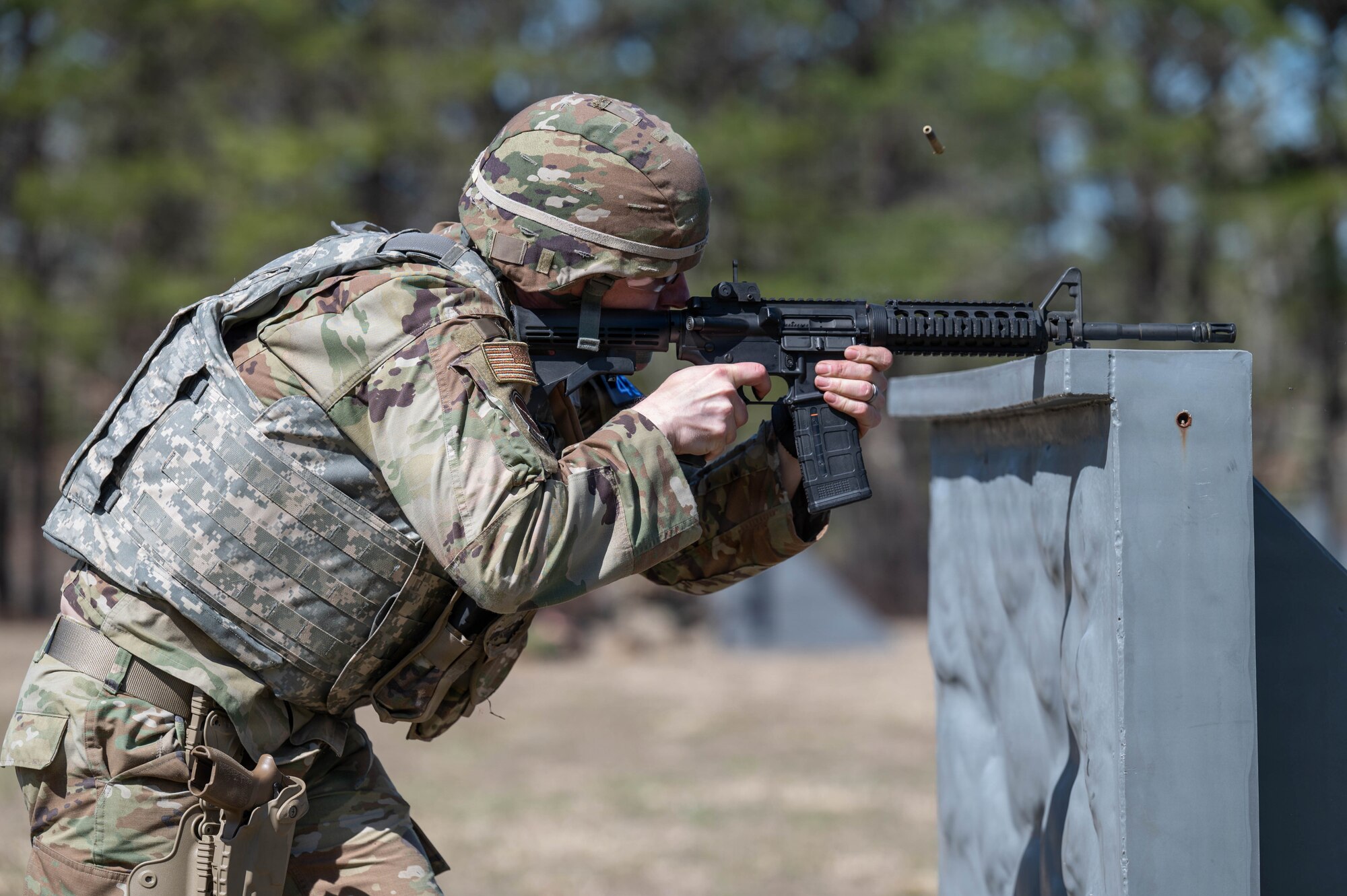 Airman shoots at a target.