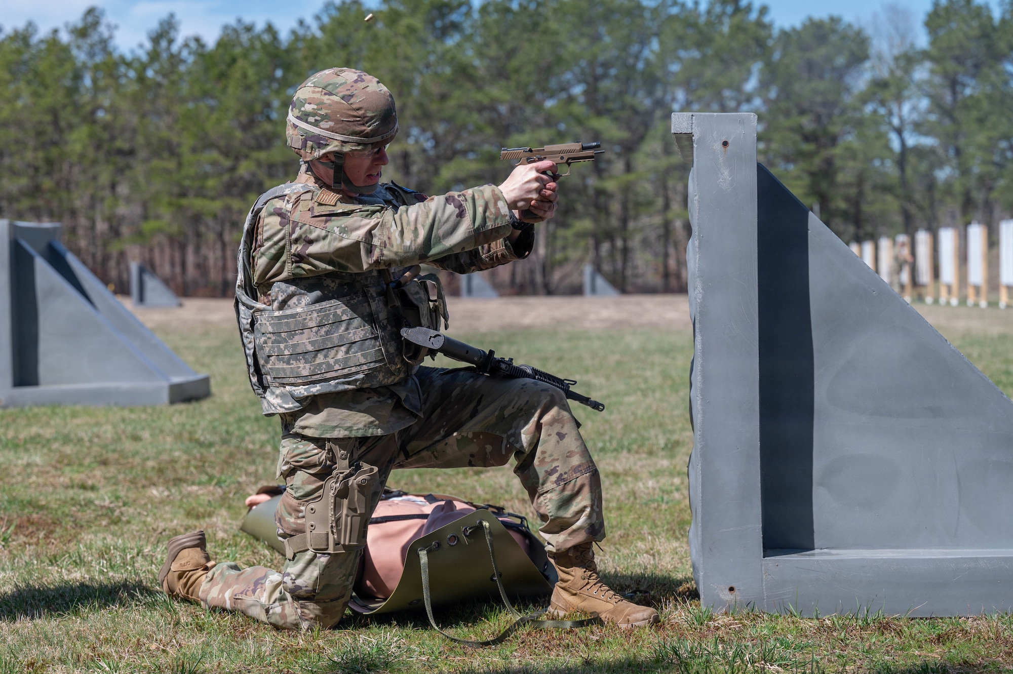 Airman shoots at a target.