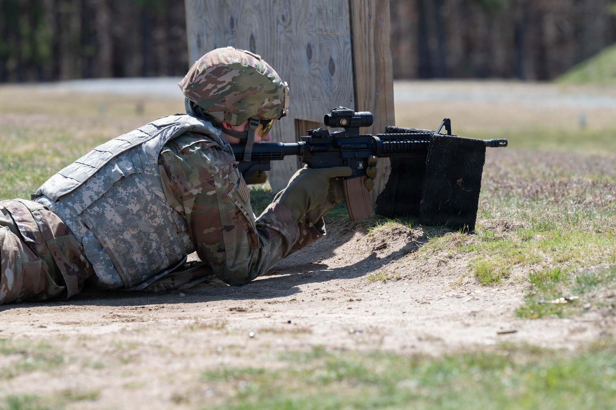 Airman shoots an M4 rifle.