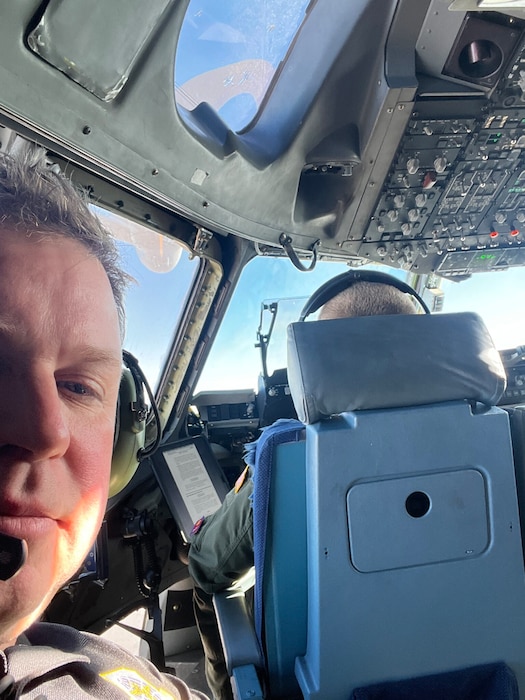 Mark Sutherland, Air Mobility Command civic leader, poses with a pilot in the cockpit of a U.S. Air Force C-17 Globemaster III aircraft at Altus Air Force Base, Oklahoma, April 8, 2026. (Courtesy photo)