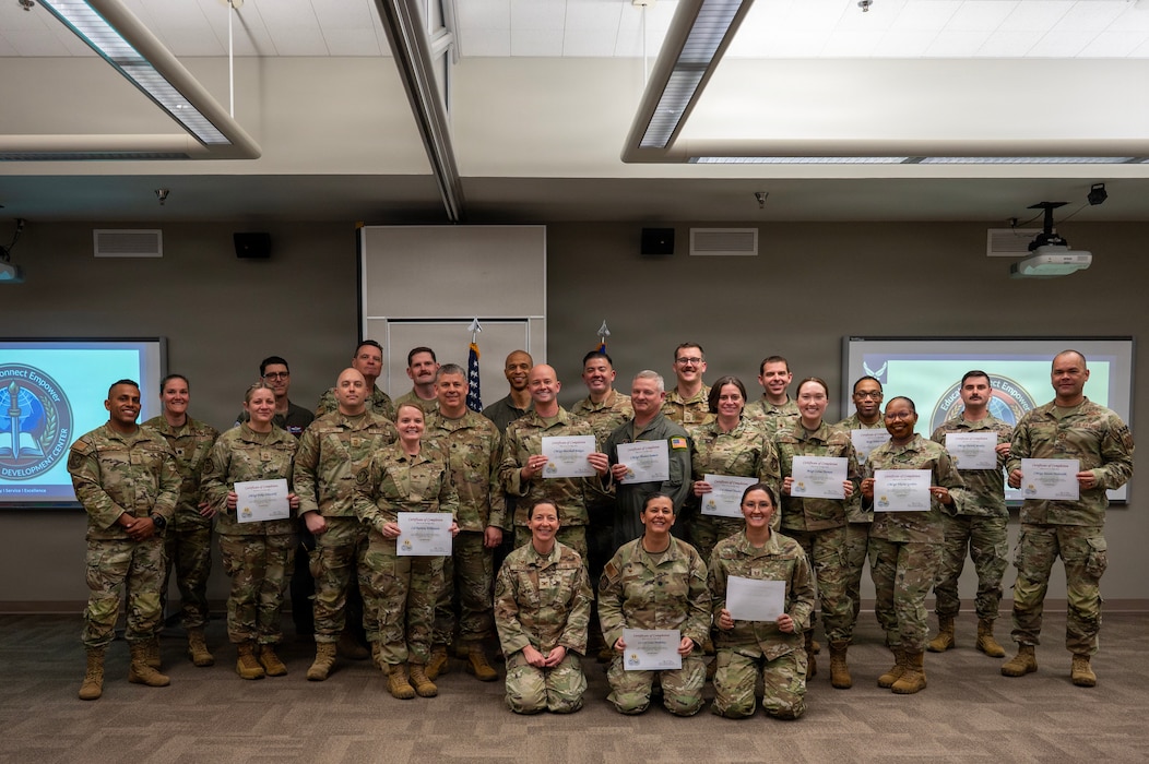 Triad Course instructors and students pose for a photo at the end of a Triad Course at Joint Base Lewis-McChord, Washington, on April 8, 2026.